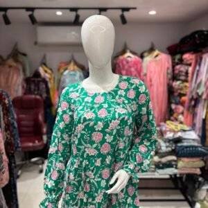 green long-sleeve dress with a pink floral print