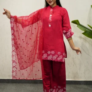 red kurta set with white floral embroidery.