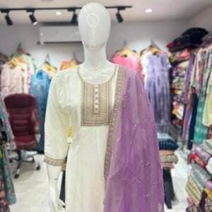 white kurta set with a purple or lavender dupatta
