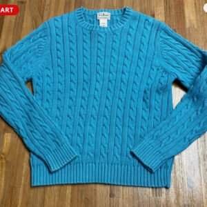crew neck cable knit sweater in a teal or blue color
